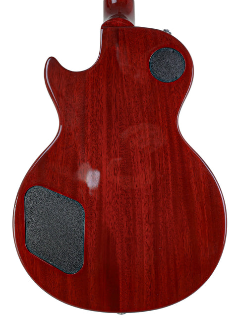 Stunning red electric guitar, a Gibson Les Paul Standard from 2018, featuring a stylish black pickguard for added flair.
