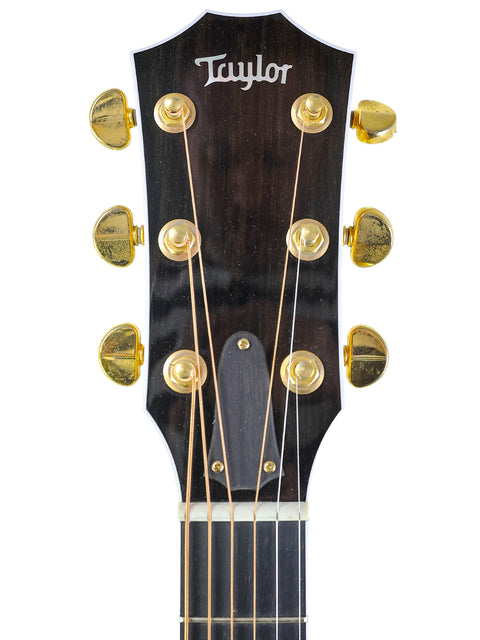 Taylor D-18E acoustic guitar, 2003 model 610CE, featuring a stunning finish and classic acoustic sound.