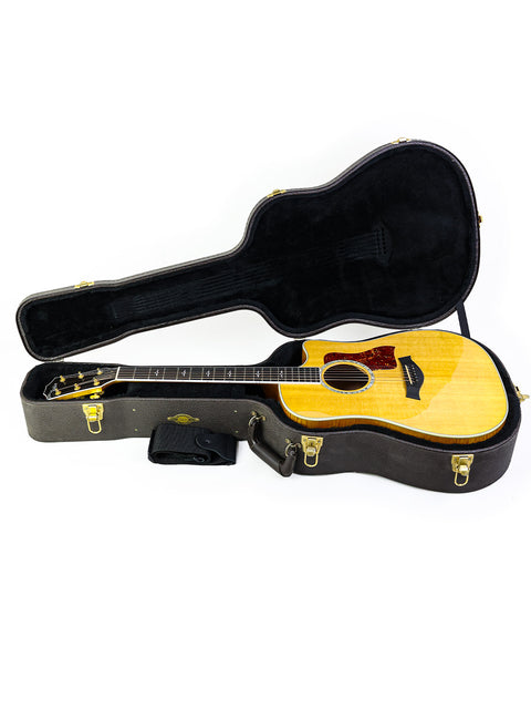 Taylor DG-1 dreadnought acoustic guitar, 610CE from 2003, highlighting its sleek body and premium sound quality.