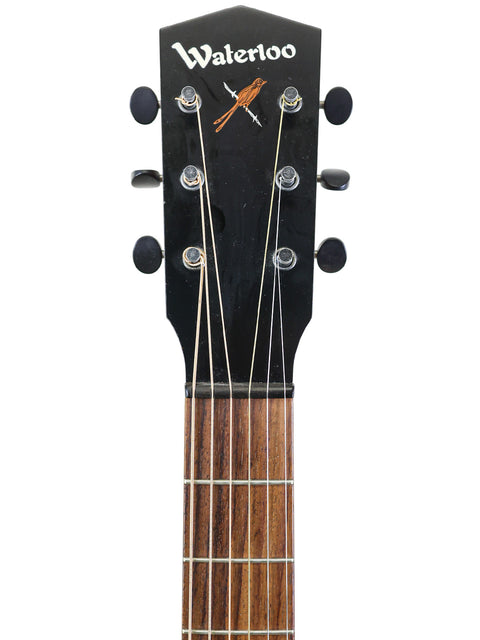 The Waterloo WL-14 X Scissortail acoustic guitar featured on a white background, emphasizing its elegant shape and finish.
