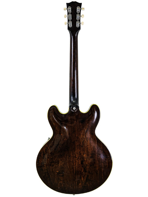 The elegant 1964 Gibson ES-335 guitar, a vintage masterpiece known for its beauty and rich musical heritage.