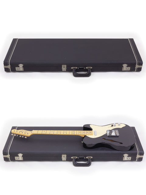 Two black guitar cases, each containing a Fender Custom Shop Telecaster Thinline, ready for performance or storage.