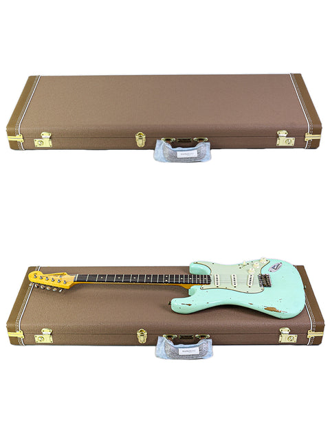 Two guitars in a case, featuring a green Fender Yuriy Shishkov Master Built ‘59 Stratocaster Relic on top.
