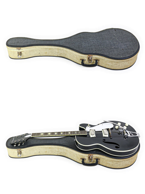Two vintage Silvertone 1446 guitars displayed with open cases on a clean white background, showcasing their classic design.
