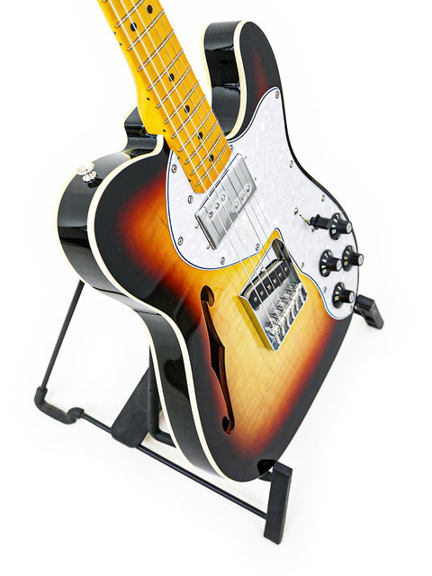 Txxx Custom Thinline '72 Partscaster (2022) with a bold black body and eye-catching yellow neck.