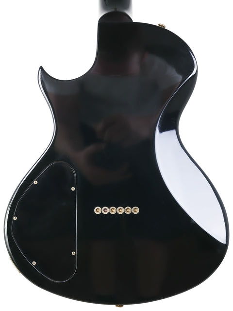 USA-made 1999 Gibson Nighthawk electric guitar in black, complete with a matching black pickguard for a classic look.
