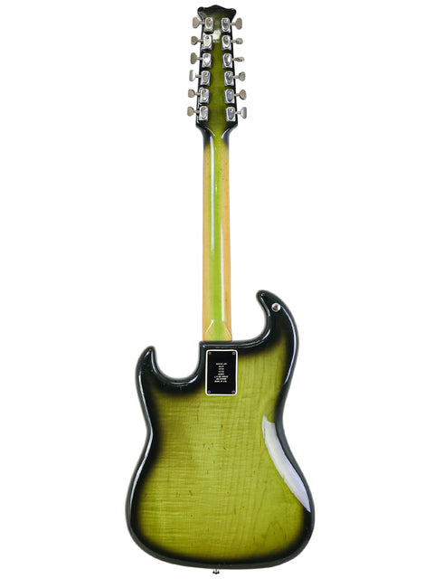 Vintage 1964 Burns Double Six 12-string guitar with a striking green body and sleek black neck, perfect for music lovers.
