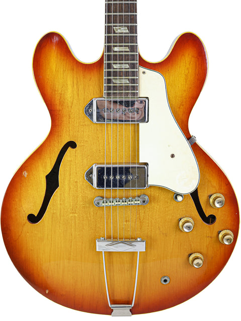 Vintage 1965 Epiphone Casino guitar with a sunburst finish, showcasing its classic design and rich color tones.