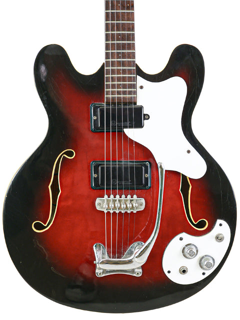 Vintage 1967 Mosrite Celebrity III guitar in red and black with a classic white pickguard.