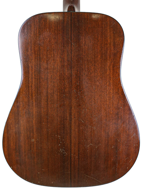 Vintage 1974 Martin D-18 acoustic guitar's back, featuring rich wood textures and a timeless design.
