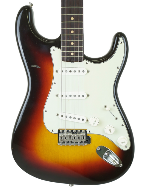 Vintage Fender American Standard Stratocaster in sunburst finish, showcasing its classic design and rich history from 1961.