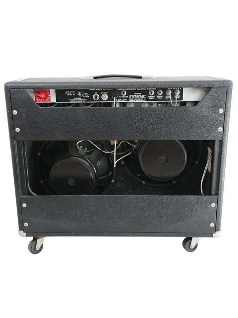 Vintage Fender Twin Reverb 2 x 12" combo amplifier from 1974, equipped with wheels and dual speakers for easy transport.