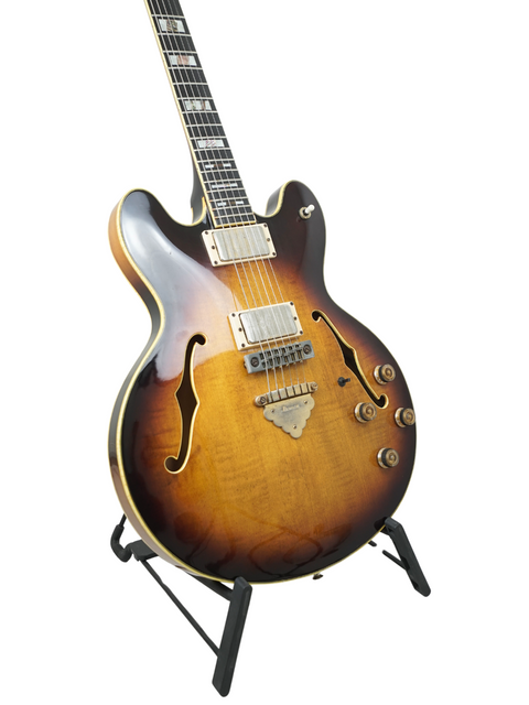 Vintage Ibanez Artist 2630 guitar, featuring a sunburst finish, showcased on a stand, dating back to 1979.