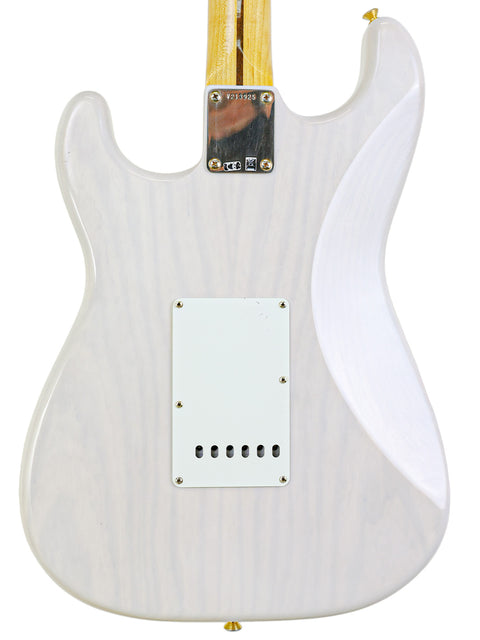 White electric guitar body with visible wood grain and back plates.
