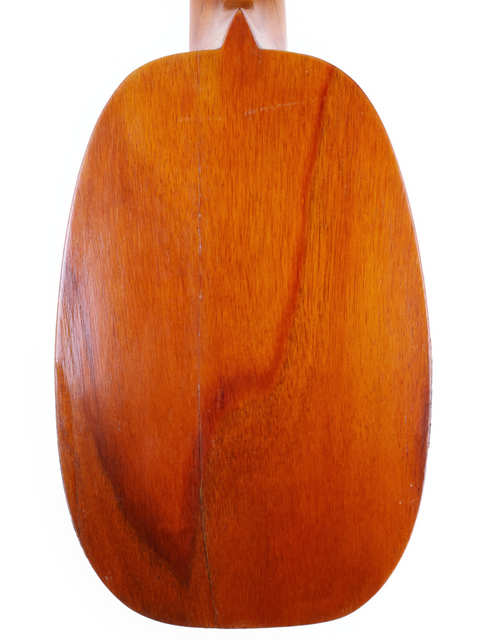 Wooden-bodied and necked, this 1928 Kamaka Pineapple Style #3 Ukulele reflects timeless craftsmanship and vintage charm.