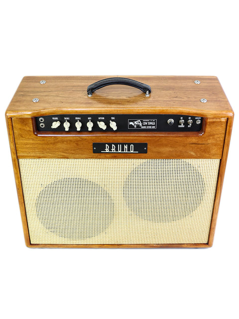 Wooden guitar amplifier with control knobs and a "BRUNO" logo on a white background.