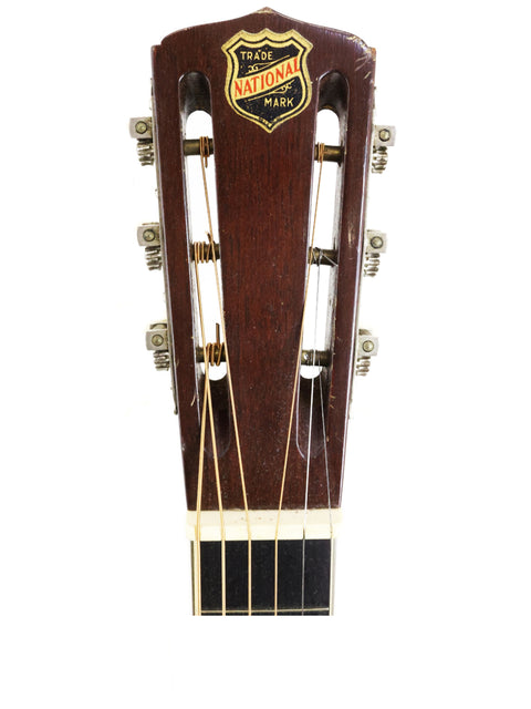 1955 Martin D-18E acoustic guitar alongside a 1932 National Tricone Style 1.5 Squareneck, showcasing vintage craftsmanship.