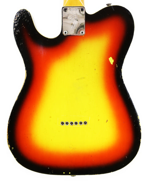 1966 Vintage Fender Custom Telecaster with a distinctive yellow and orange body, highlighting its classic design.