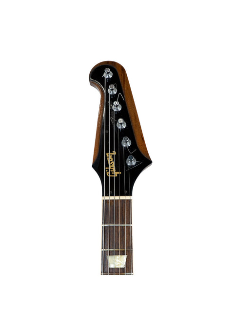 1991 Gibson Firebird V Reissue guitar showcasing a sleek black headstock paired with a warm brown body.