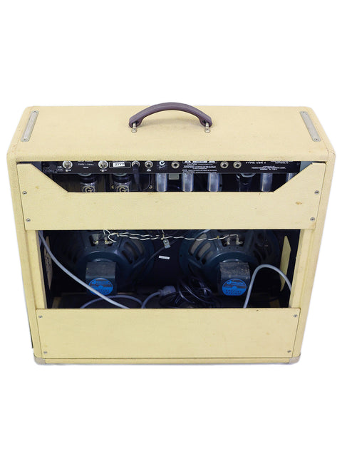 2003 Fender Custom Shop Vibro-King Combo Amp in yellow, showcasing a black handle for convenient carrying.
