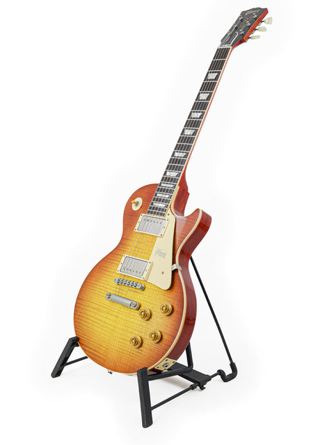 2018 Gibson Custom Shop '59 Les Paul Standard R/I guitar displayed on a stand with a white backdrop.