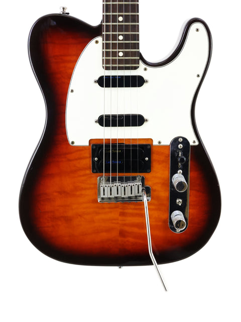 A 1992 Fender Telecaster Plus Deluxe featuring a striking sunburst finish, highlighting its iconic shape and craftsmanship.