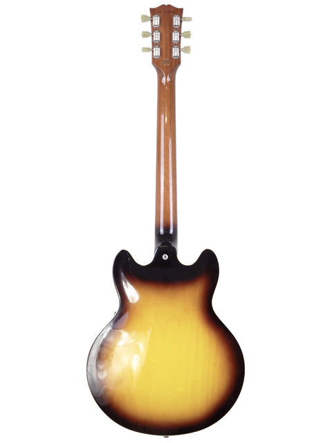 A 2009 Gibson Custom Shop ES 339 guitar featuring a beautiful sunburst finish, made in Memphis, USA, perfect for music lovers.