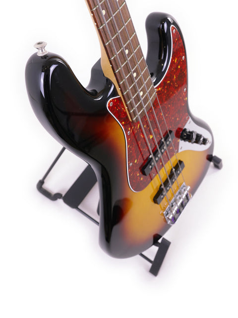 A 2013 Fender Jazz Bass from Mexico featuring a bold black and red body, perfect for any music enthusiast or collector.