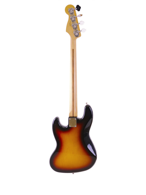 A 2013 Fender Jazz Bass in sunburst finish, highlighting its elegant curves and rich color.