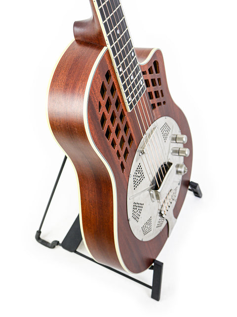 A 2016 National ResoRocket WB Steel guitar featuring a wooden body, elegantly positioned on a metal stand.
