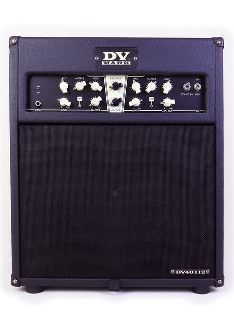 A DV Mark guitar amplifier with control knobs and a black speaker grille.