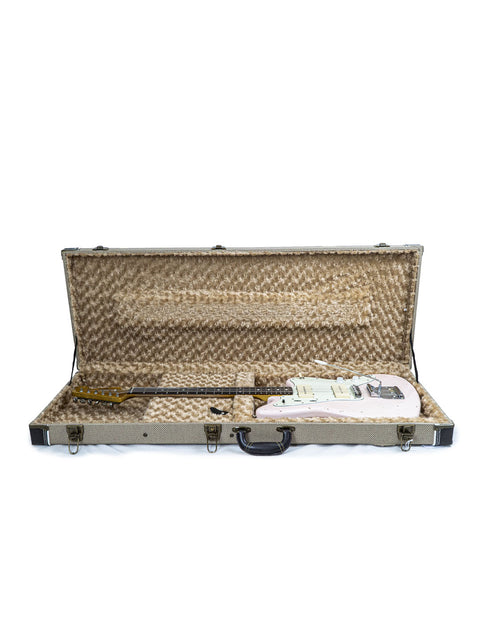 A Rittenhouse JM-63 guitar case opens to reveal a guitar, representing quality craftsmanship from the USA in 2020.