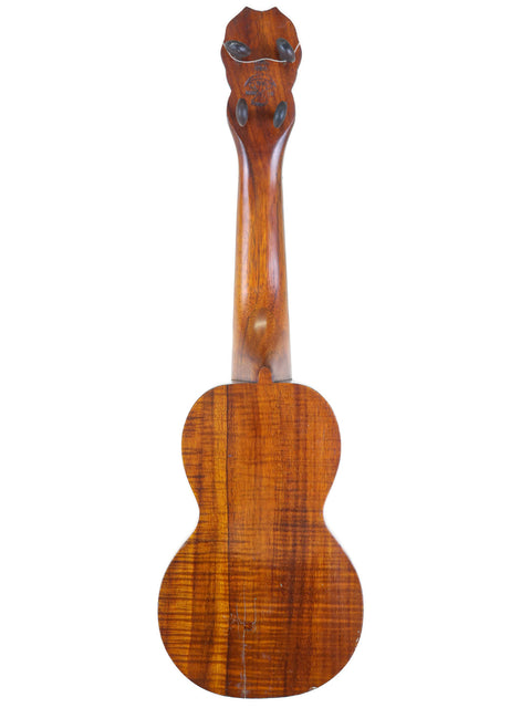 A beautifully crafted Paul F. Summers 'Moana' Style 5 Koa Ukulele from 1927, highlighting its wooden body and neck design.