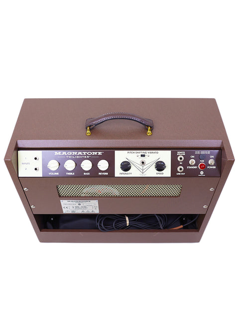 A brown 2021 Magnatone Twilighter 1x12 Combo amplifier on a white backdrop, emphasizing its stylish and compact form.