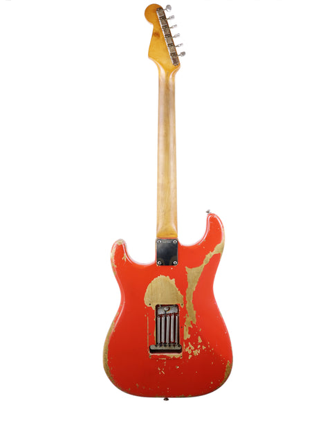 A classic 1964 Fender L Series Stratocaster, featuring a vibrant Fiesta Red body and elegant gold accents.
