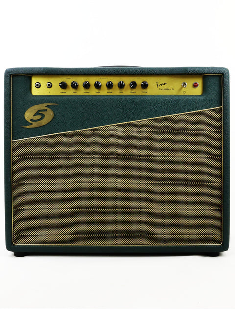 A green and gold Category 5 Ivan Combo Amplifier from 2012 rests on a clean white background, showcasing its vibrant design.