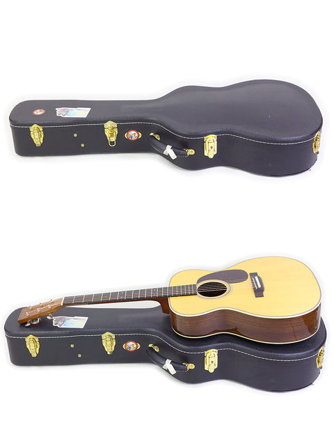 A pair of guitars positioned differently, highlighting a 2018 Martin Custom Shop 000-28 made in the USA.