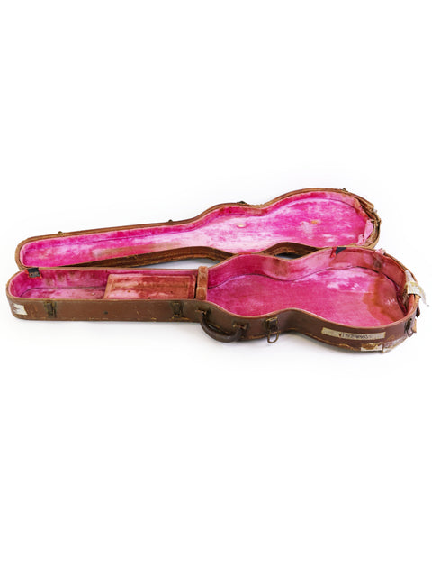 A pair of pink Lifton 50s Gibson guitar cases displayed against a white backdrop, highlighting their vibrant color and vintage appeal.
