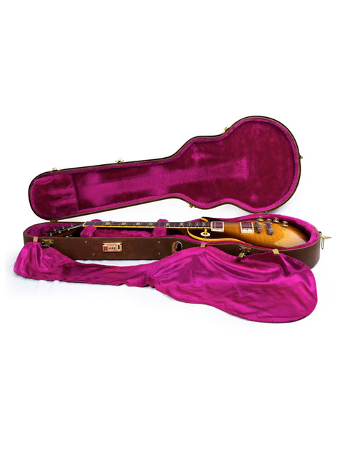 A pink-covered guitar case, highlighting a Gibson Pre-Historic 1960 Reissue Les Paul, made in the USA in 1993.