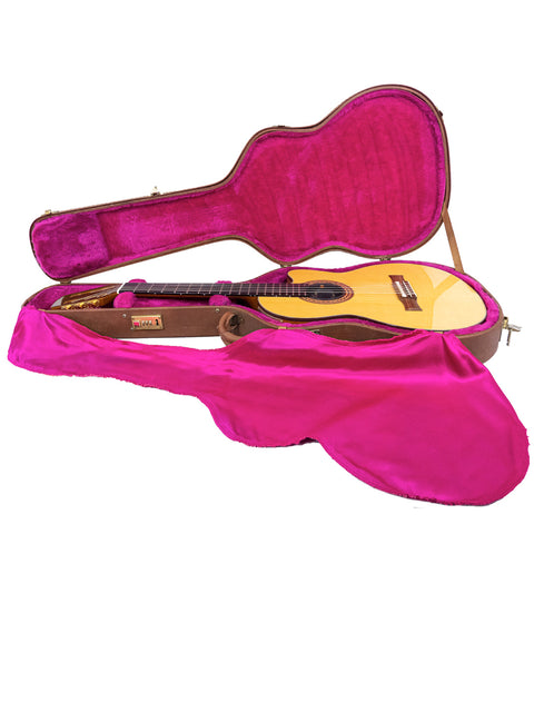 A pink guitar case displayed against a white background, housing a 2001 Gibson Chet Atkins CEC Classical Electric Guitar.
