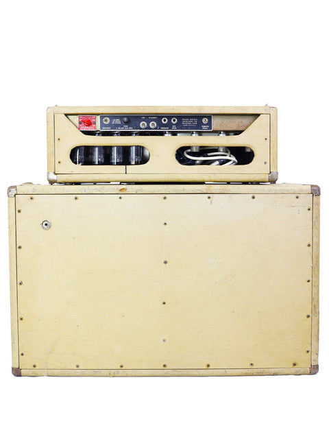 A retro Fender Bandmaster amplifier from 1963, featuring a stylish white case that adds charm to any setup.