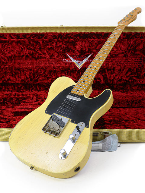 A striking yellow 1962 Fender Telecaster, highlighting its iconic shape and vintage appeal, ideal for collectors and musicians alike.
