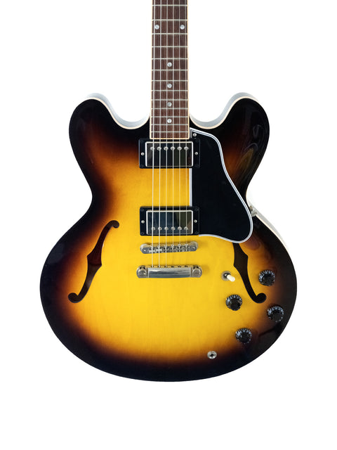  A sunburst-finished Gibson Custom ES-335 guitar with dot inlays, showcasing its elegant design and craftsmanship from 2012.