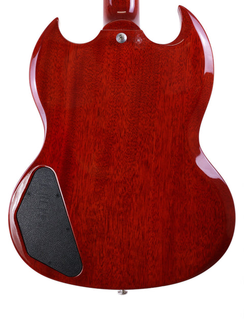 A vibrant red Gibson SG Standard ‘61 guitar adorned with a black pickguard, exemplifying a classic rock aesthetic.