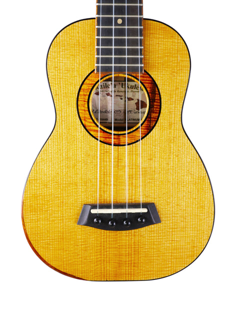A vibrant yellow ukulele with a sleek black pickguard, showcasing the Kanile’a Platinum Limited Edition from Hawaii, 2017.