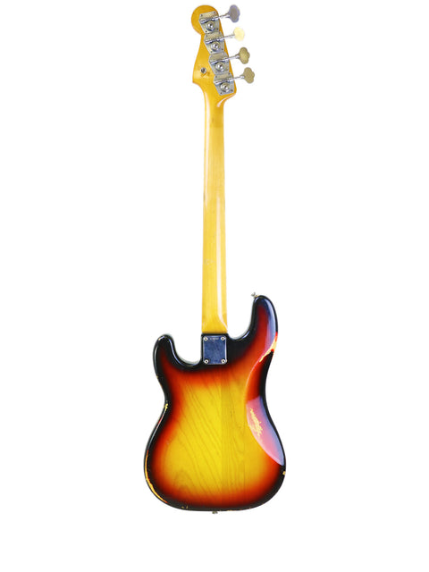 A vintage Fender Precision Bass from 1972, featuring a striking yellow and orange body design.