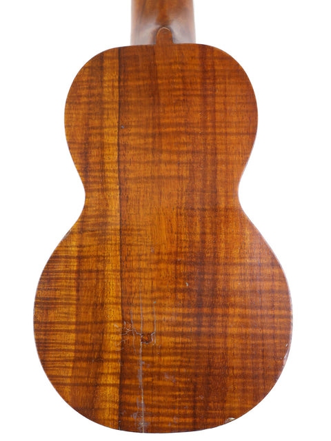 A vintage Paul F. Summers 'Moana' Style 5 Koa Ukulele with a wooden back and neck, crafted in Hawaii around 1927.