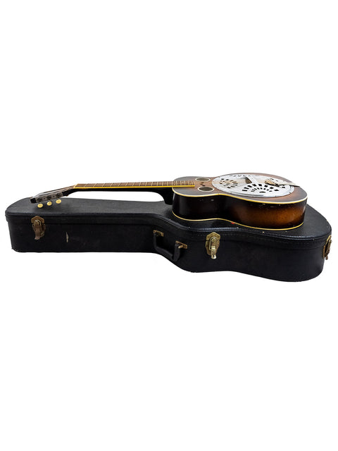 A vintage Regal Dobro guitar case from the 1930s, featuring a guitar nestled inside, highlighting its historical value.
