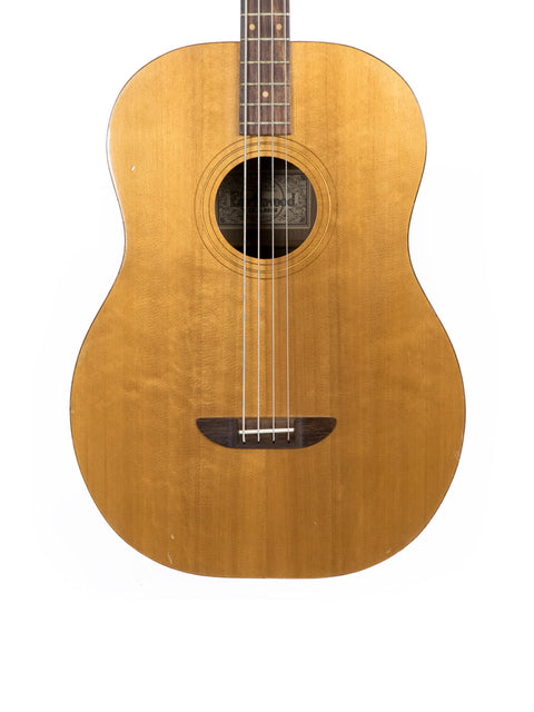 An Ernie Ball Earthwood Bass guitar from the 1980s showcased on a plain white backdrop.