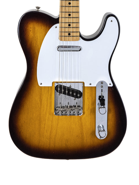  An electric guitar with a sunburst finish, showcasing the Fender American Vintage ’58 Telecaster Special Edition from 2012.
